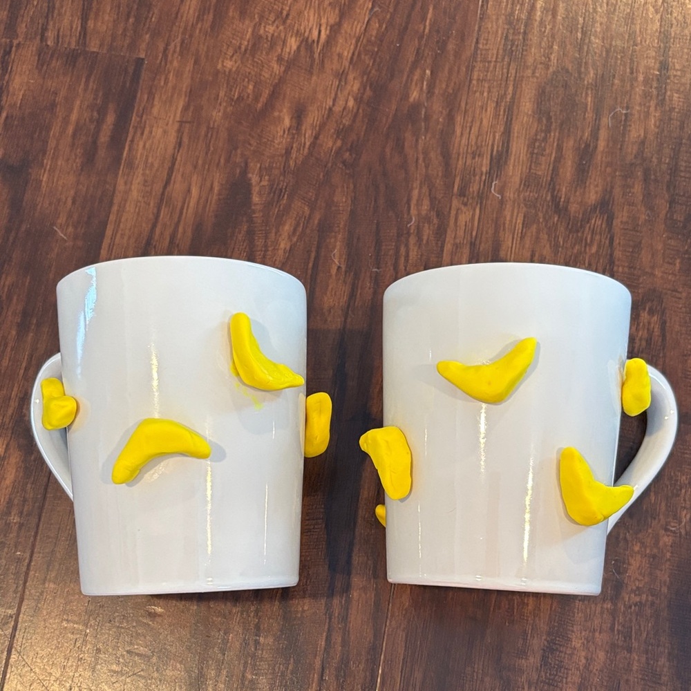 Set of 2 White Ceramic Mugs with Yellow Banana Clay Accents